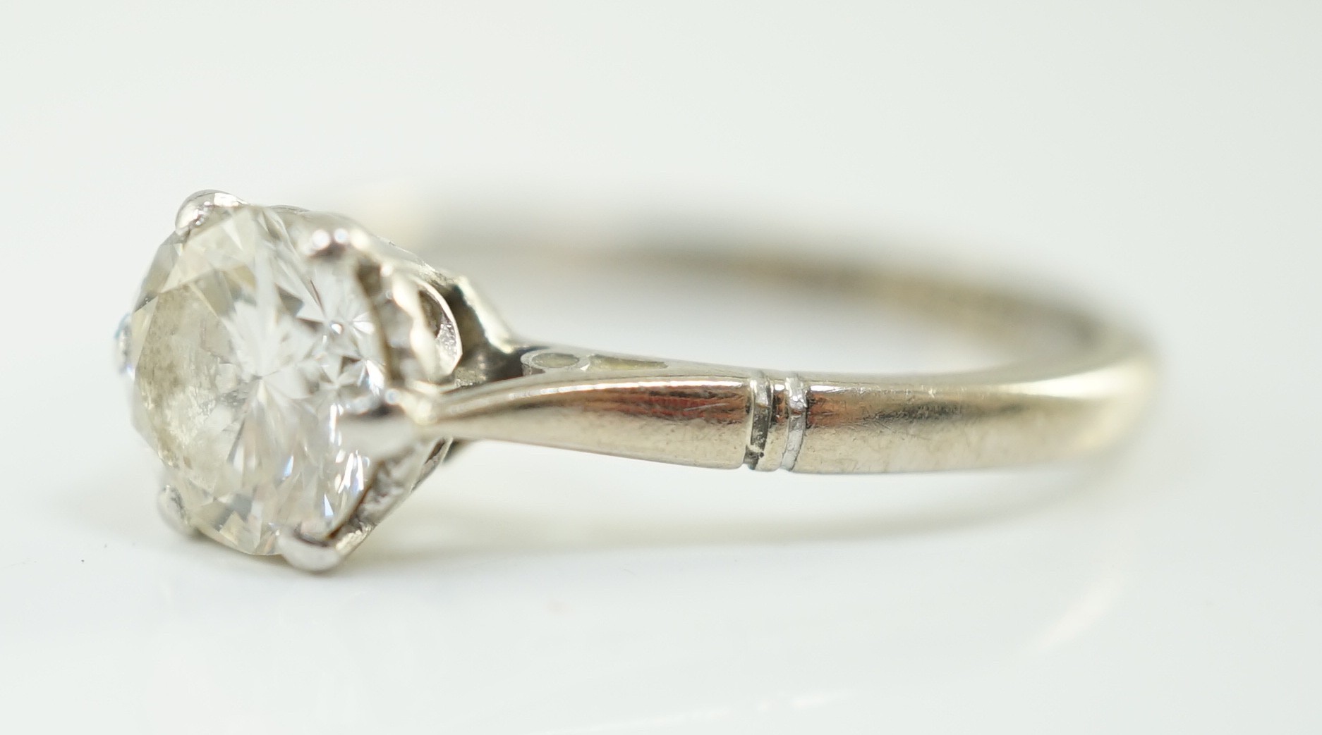 An 18ct white gold, platinum and solitaire diamond set ring